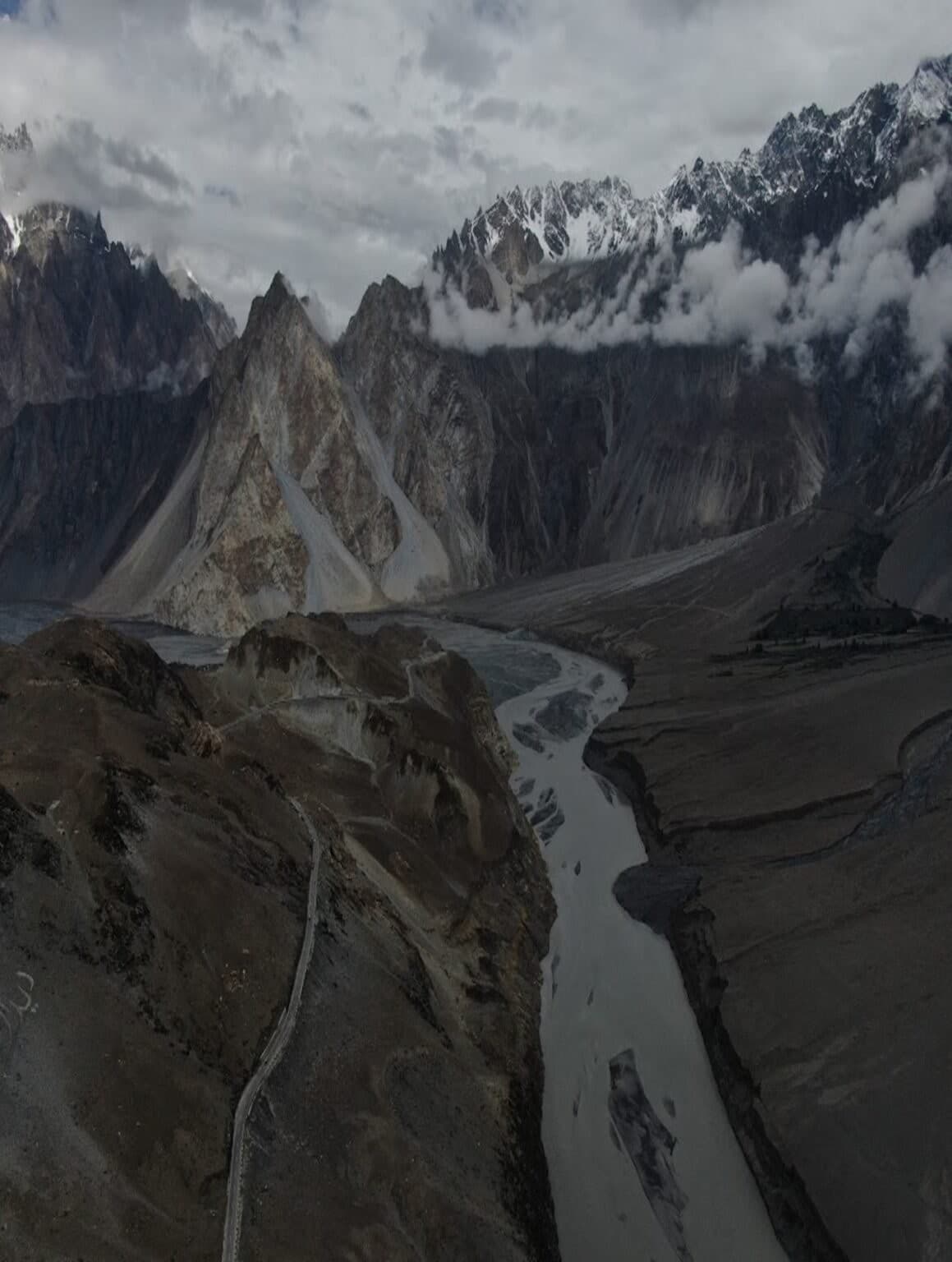 Aerial view of the Passu Cones with a braided glacial river and mountain road
