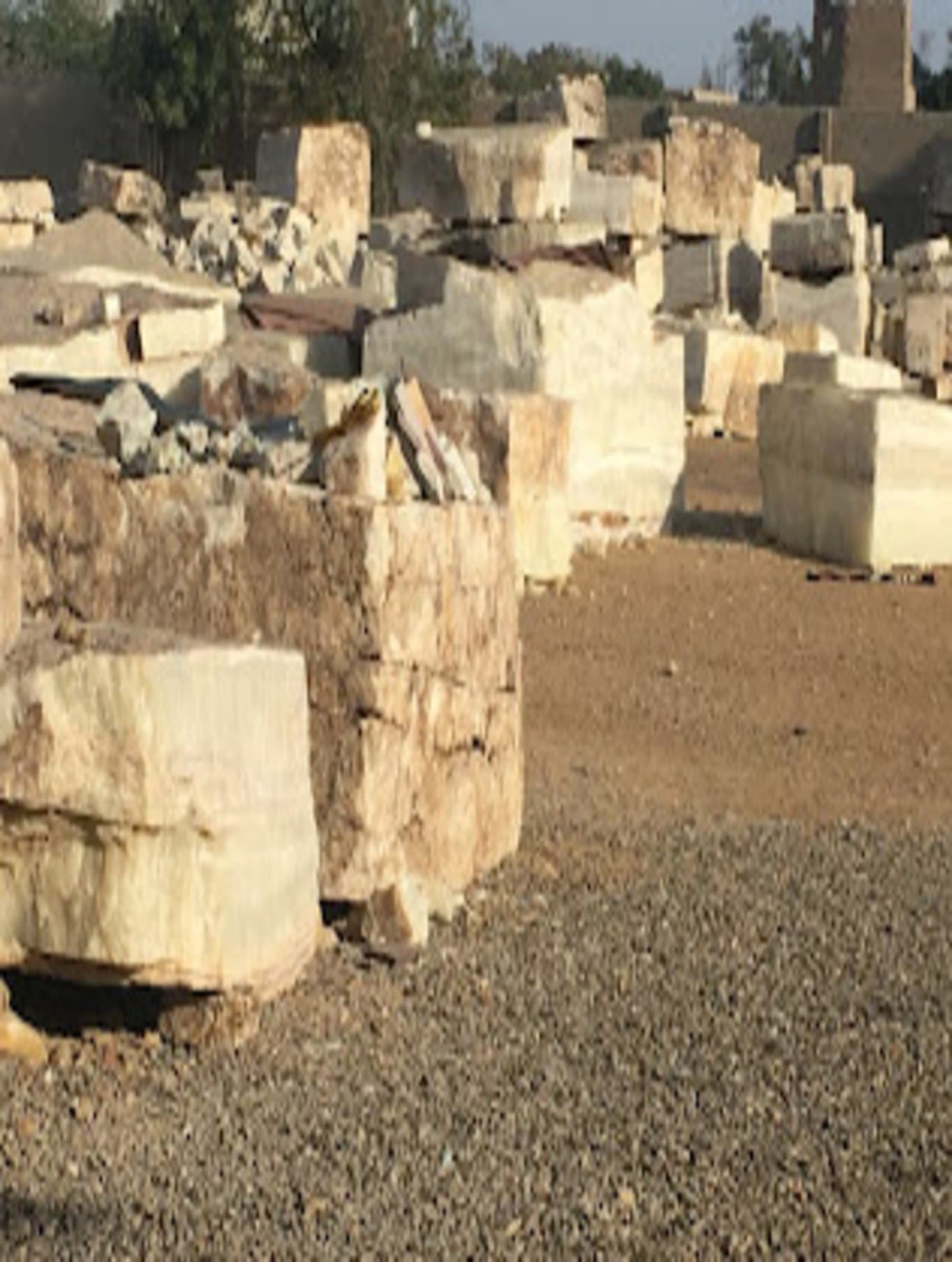 Cut marble blocks stacked at a stone yard in Gilgit-Baltistan — the host rock this article's ruby deposits form within