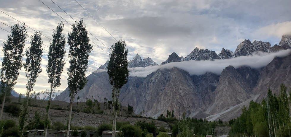 Passu peaks at dusk seen through poplar trees, Hunza Valley