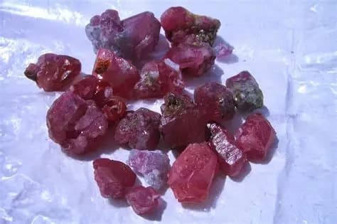 A collection of rough, untreated ruby crystals from Hunza Valley
